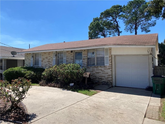 3008 Lake Villa Dr, Metairie, LA 70002 - ranch-style house featuring an attached garage, brick siding, and driveway