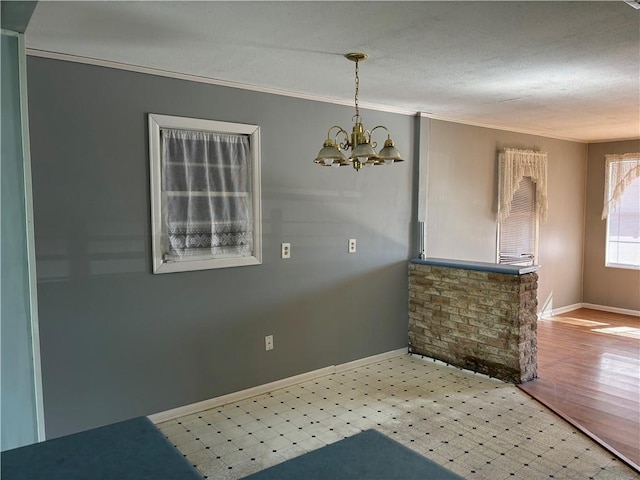 3008 Lake Villa Dr, Metairie, LA 70002 - interior space with crown molding, baseboards, and a chandelier