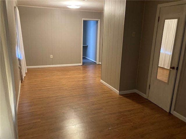 3008 Lake Villa Dr, Metairie, LA 70002 - empty room with baseboards, wood finished floors, and crown molding