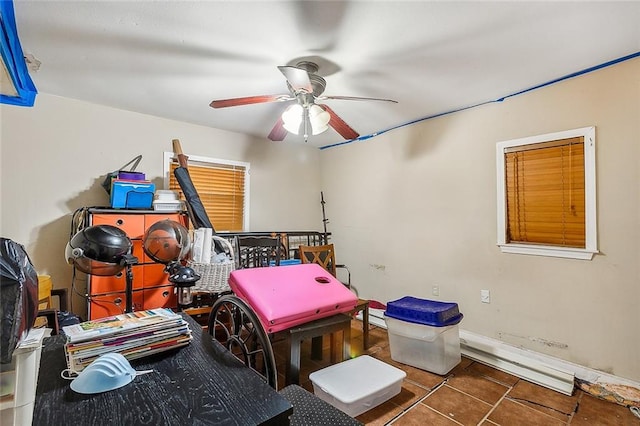 bedroom with ceiling fan and dark tile patterned flooring