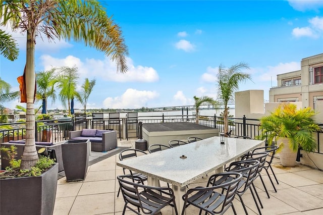 view of patio / terrace featuring outdoor lounge area, a balcony, and a water view