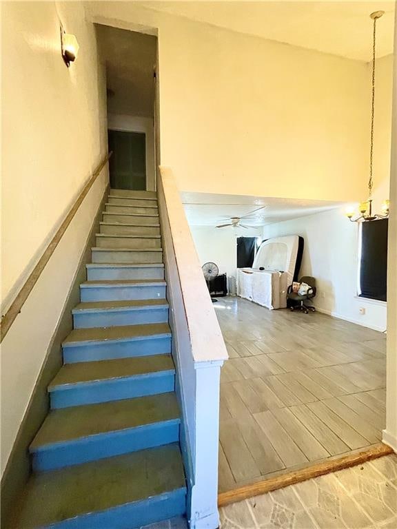 stairway featuring hardwood / wood-style floors