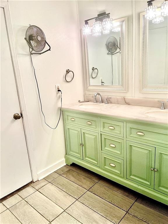 bathroom featuring vanity and hardwood / wood-style floors