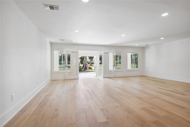 unfurnished living room with light hardwood / wood-style flooring