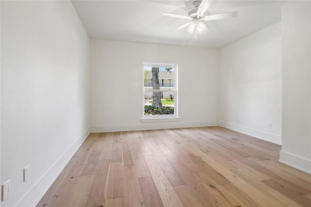 spare room with light hardwood / wood-style flooring and ceiling fan