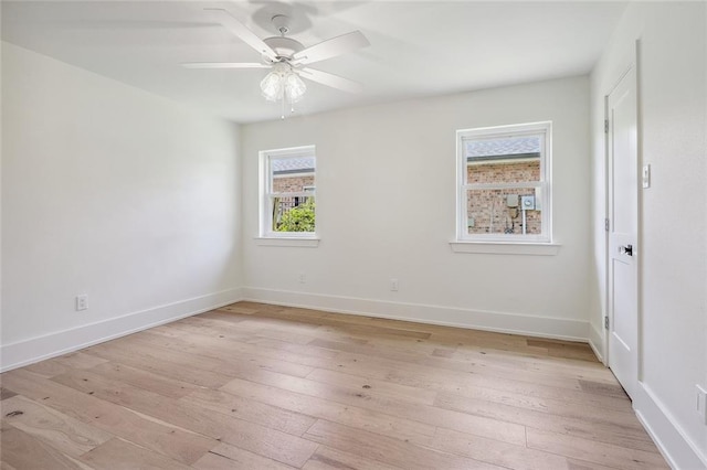 unfurnished room with ceiling fan and light hardwood / wood-style flooring