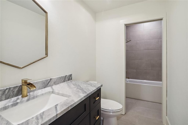 full bathroom with vanity, toilet, tiled shower / bath combo, and tile patterned flooring