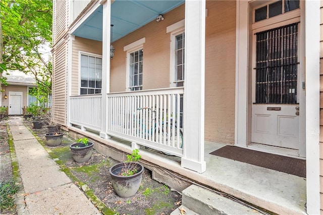 doorway to property featuring a porch