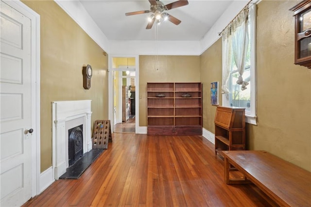 interior space with ceiling fan and hardwood / wood-style flooring