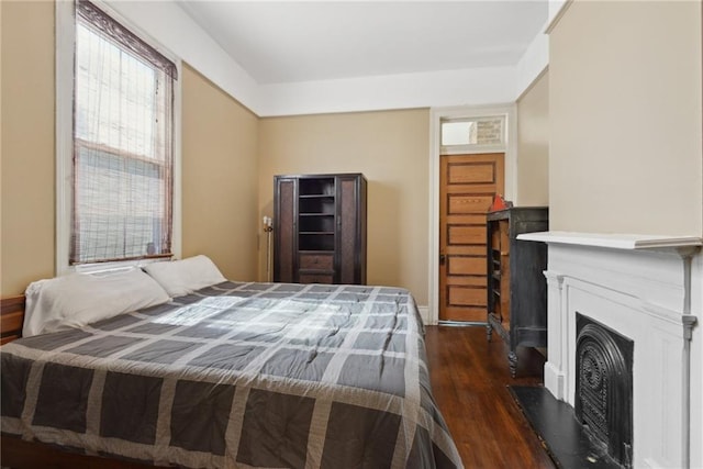 bedroom featuring dark wood-type flooring