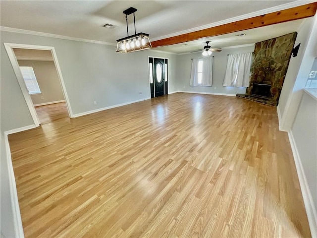 unfurnished living room with a fireplace, ornamental molding, baseboards, and light wood-type flooring
