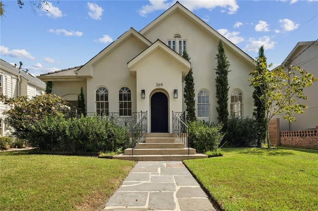 view of front of property with a front lawn