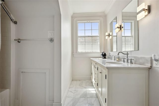 bathroom with ornamental molding and vanity