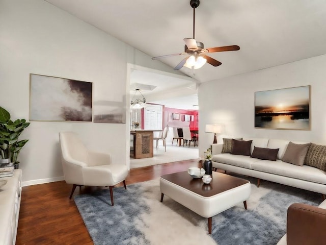 living room featuring lofted ceiling, dark hardwood / wood-style flooring, and ceiling fan