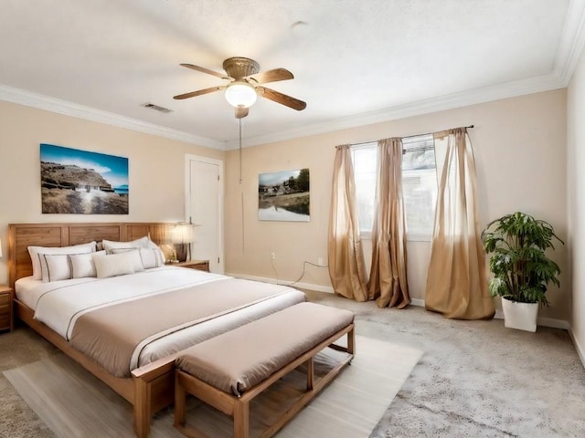 bedroom featuring ceiling fan, crown molding, and light carpet