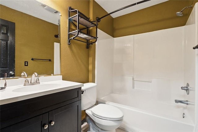 full bathroom featuring bathing tub / shower combination, vanity, and toilet