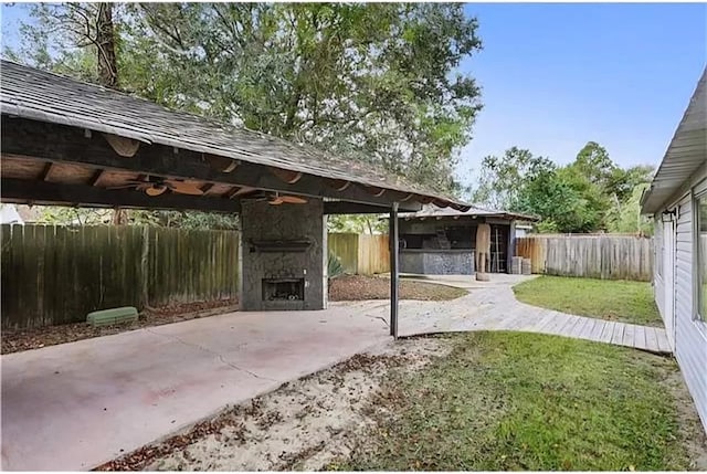 view of patio / terrace featuring a gazebo and ceiling fan