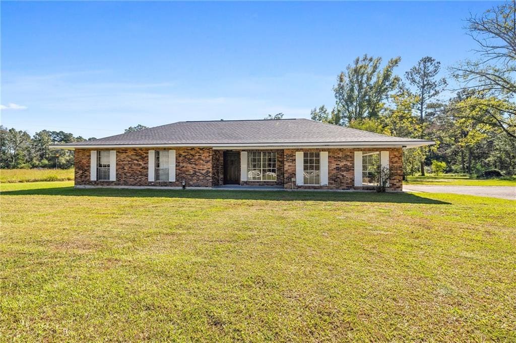 30750 441st Hwy, Holden, LA 70744 - single story home with brick siding and a front yard