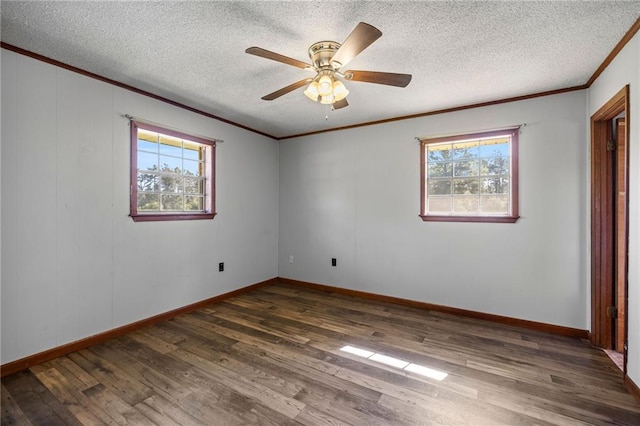 unfurnished room with a textured ceiling, crown molding, ceiling fan, and dark wood-type flooring