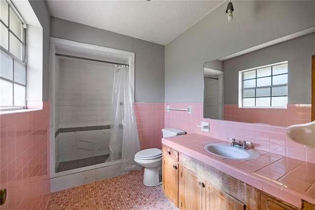 bathroom with curtained shower, tile patterned flooring, toilet, and plenty of natural light