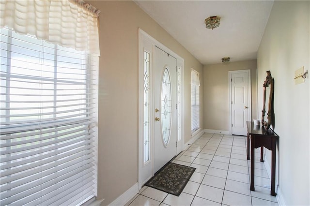 entryway featuring light tile patterned floors and a wealth of natural light