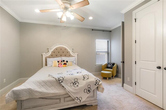 bedroom with ceiling fan, light carpet, and ornamental molding