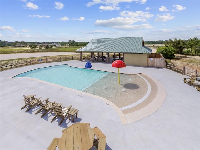 view of swimming pool featuring a patio area and a gazebo