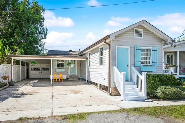 view of front of property with a carport