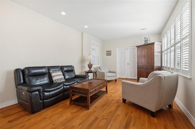 living room with light hardwood / wood-style floors