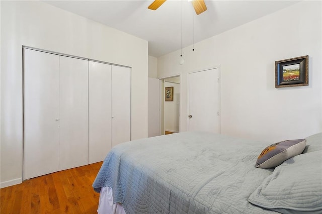 bedroom with ceiling fan and hardwood / wood-style flooring