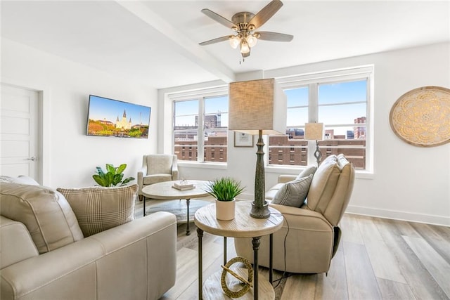 living room featuring light hardwood / wood-style floors and ceiling fan