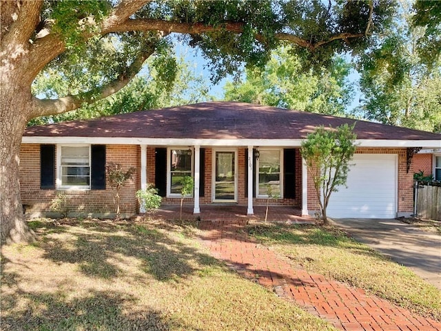 ranch-style home with a garage and a front yard