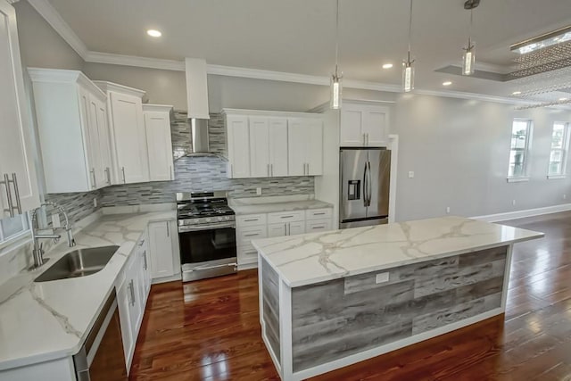 kitchen featuring stainless steel appliances, white cabinets, and a center island