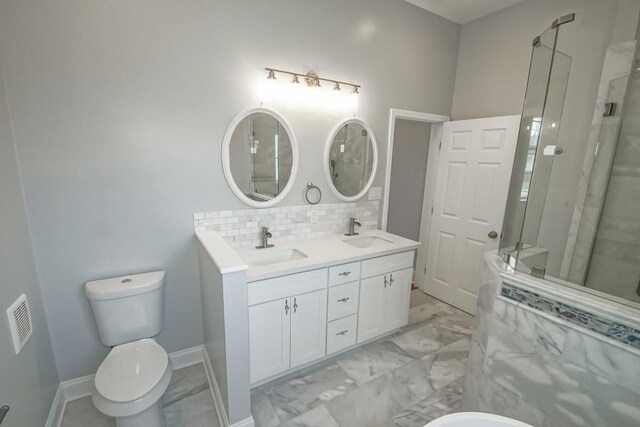 bathroom featuring walk in shower, backsplash, vanity, and toilet