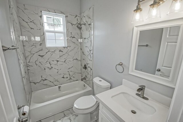 full bathroom featuring vanity, toilet, and tiled shower / bath