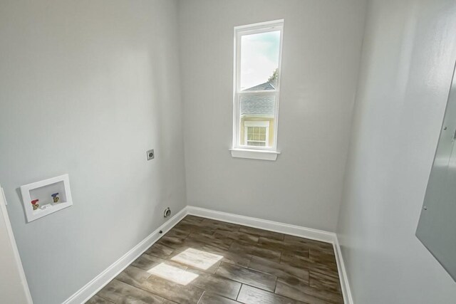 clothes washing area with dark hardwood / wood-style flooring, washer hookup, and electric dryer hookup