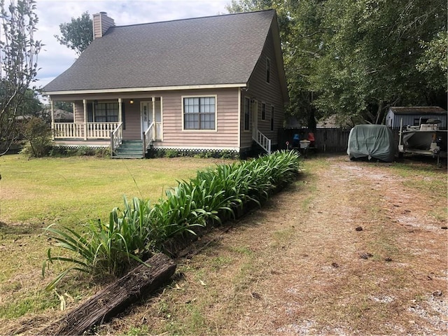 view of front facade with a front yard and a porch