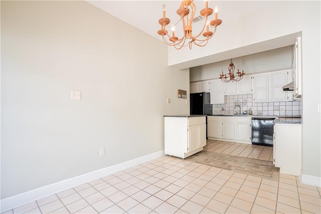 kitchen with black appliances, decorative light fixtures, white cabinetry, an inviting chandelier, and decorative backsplash