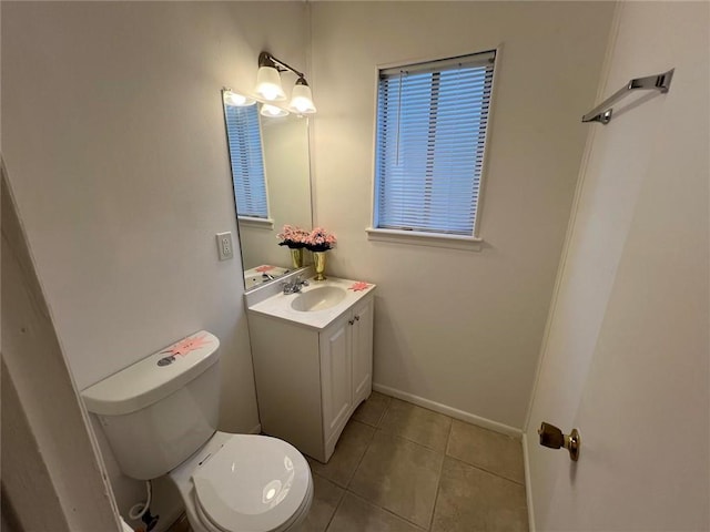 bathroom featuring vanity, toilet, and tile patterned floors