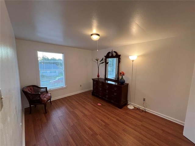 unfurnished room featuring dark wood-type flooring