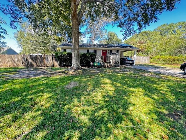 40735 Chinchas Creek Rd, Slidell, LA 70461 - ranch-style house with driveway and a carport