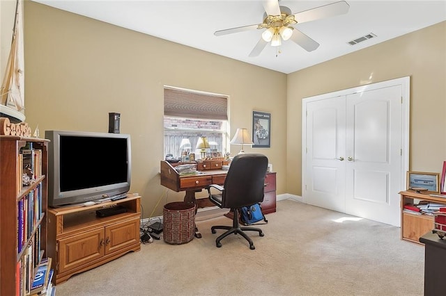 office with light carpet and ceiling fan