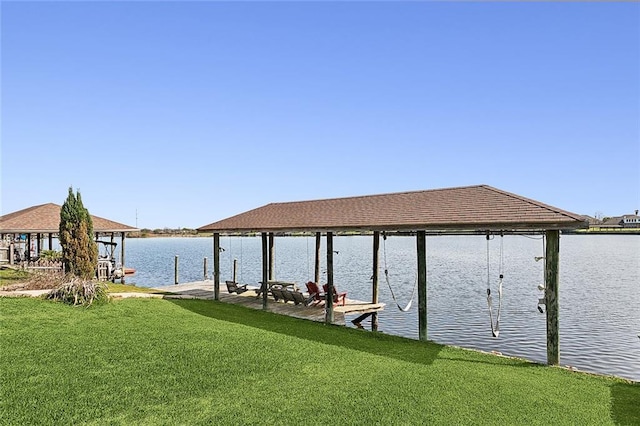 view of dock featuring a yard and a water view