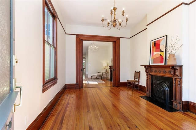 interior space with a chandelier and hardwood / wood-style flooring