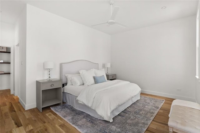 bedroom with light wood-type flooring and ceiling fan