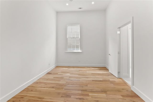 spare room with light wood-type flooring