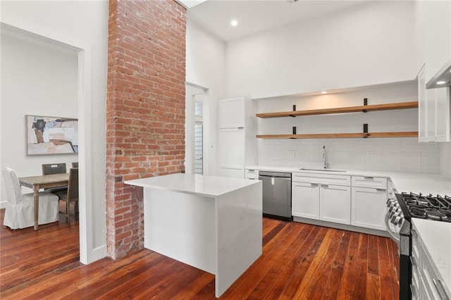 kitchen featuring white cabinets, dishwasher, dark wood-type flooring, and gas stove