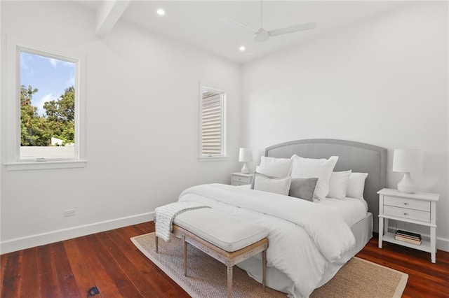 bedroom with ceiling fan and dark hardwood / wood-style floors