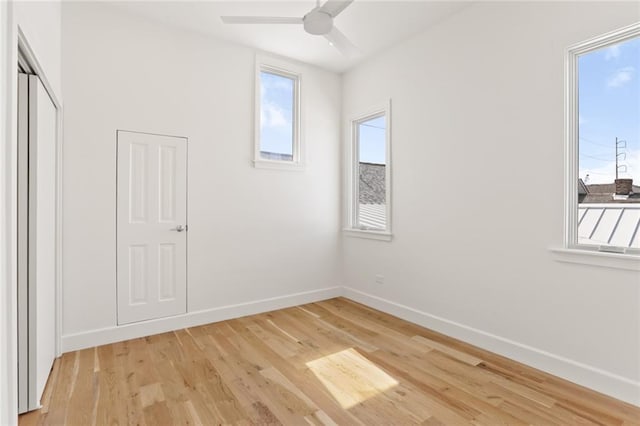 unfurnished bedroom with light wood-type flooring and ceiling fan