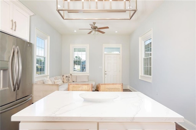 bathroom with wood-type flooring and ceiling fan